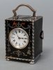 A small English tortoiseshell & silver travelling clock, by William Comyns, circa 1902