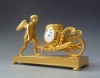 Attractive small mantel clock / pendulette, Amor  with wheelbarrow, Austria circa 1810.