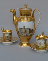 Empire coffee pot and two cups and saucers with views of Amsterdam, Haarlem and Rotterdam