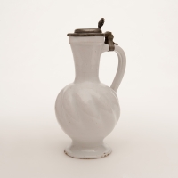 A Twisted Jug with Pewter Lid in White Dutch Delftware