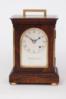A small English brass bound rosewood library timepiece by Mc Cabe London, circa 1840