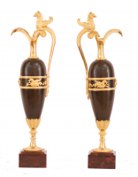A pair of empire patinated bronze and fire gilded ewers, Circa 1810