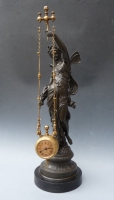  A French Mystery Clock, draped figure of nymph holding a swinging clock, c. 1890. 