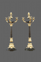 A pair of ormolu and patinated Charles X French four-light candelabres