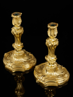 Pair of French Louis XV candlesticks after a design by Juste Aurele  Meissonnier