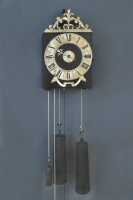 An early French provincial iron and brass Morbier wall clock with brass pointer, 1730