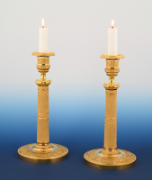 A pair of ormolu bronze Empire candle sticks