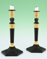 A pair of  ormolu bronze and patineted Empire candle sticks