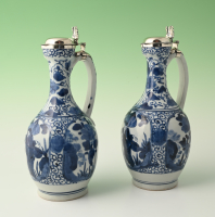 A pair of Japanese Arita porcelain pouring jugs