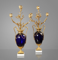 An elegant pair of French Louis Seize ormolu mounted midnight blue glass three-light vase candelabra