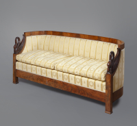 A mahogany Empire sofa with carved swans