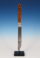 An extremely finely carved palm wood knife
