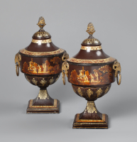 A pair of Dutch Empire tole chestnut urns