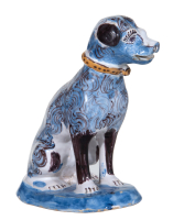 A Polychrome Sitting Dog in Dutch Delftware