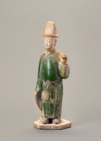 A Chinese green-glazed pottery figure of a tomb attendant