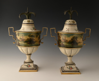 A pair of rare pewter chestnut vases