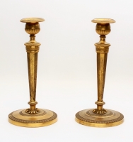 A pair French Empire fire-gilt candlesticks, circa 1800