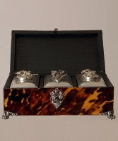 A Tortoiseshell Tea-chest with silver filigree mounts