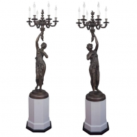 A pair of candlesticks adapted for electricity, circa 1880