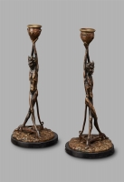An unusual pair of Art Deco candlesticks featuring Satyrs