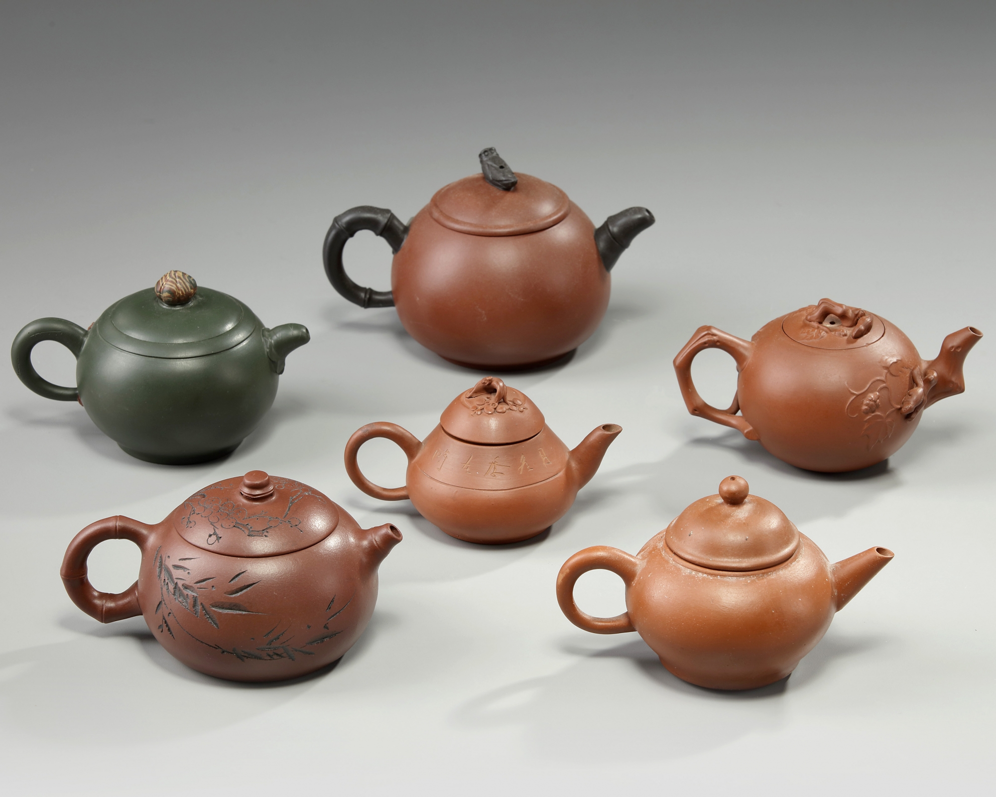 A group of six Chinese small yixing teapots OAA