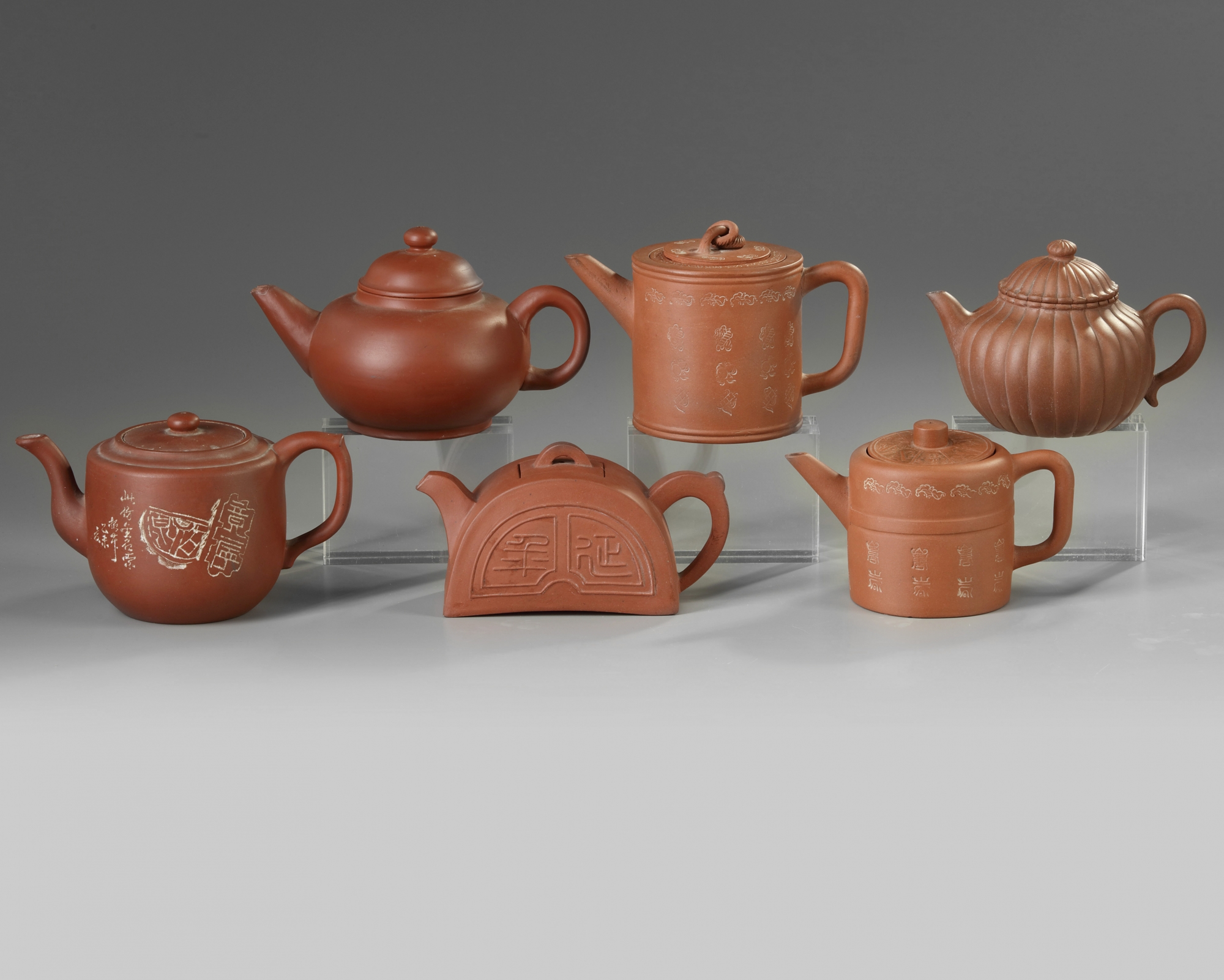 A group of six Chinese Yixing teapots OAA