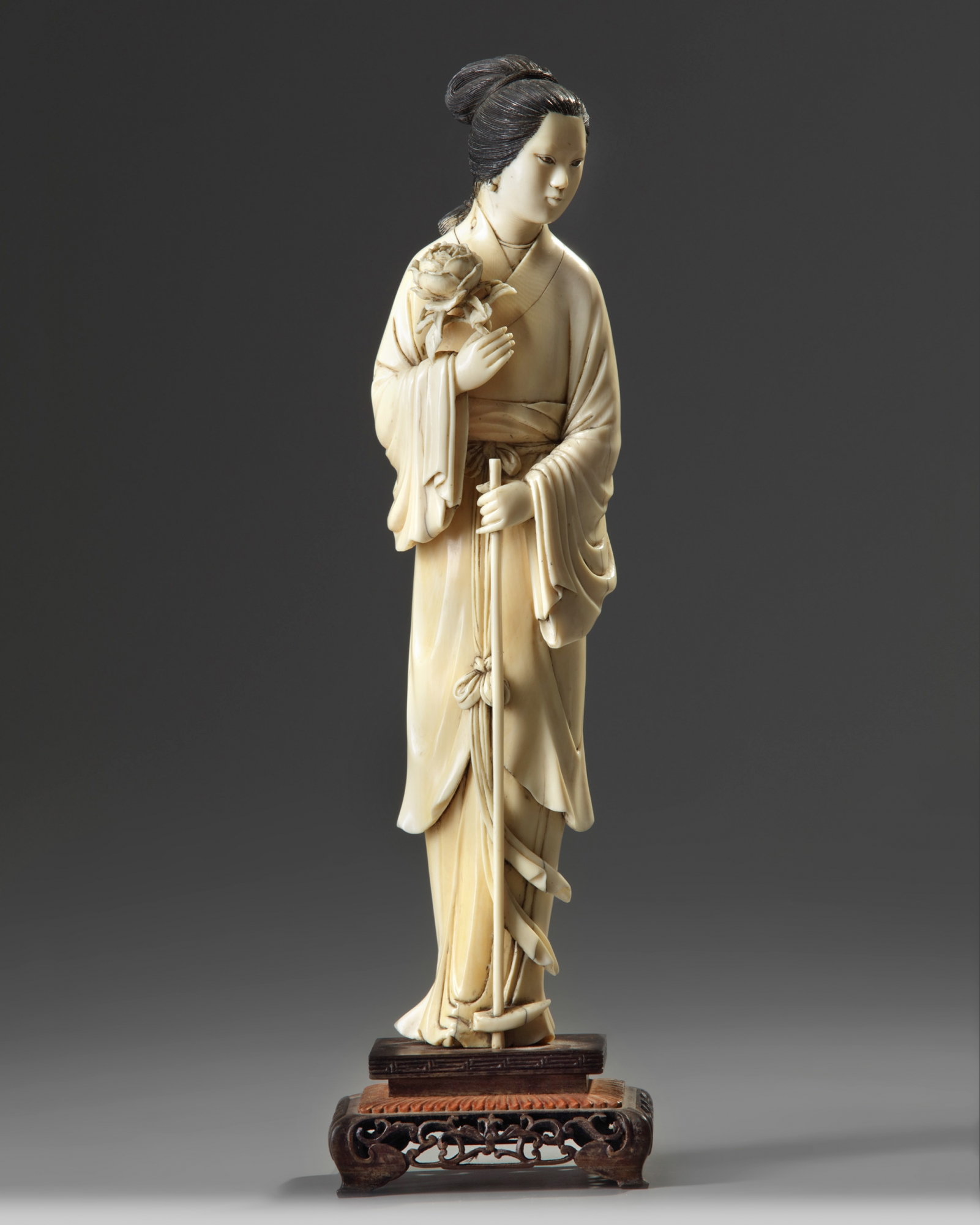A Chinese ivory carving of a lady OAA