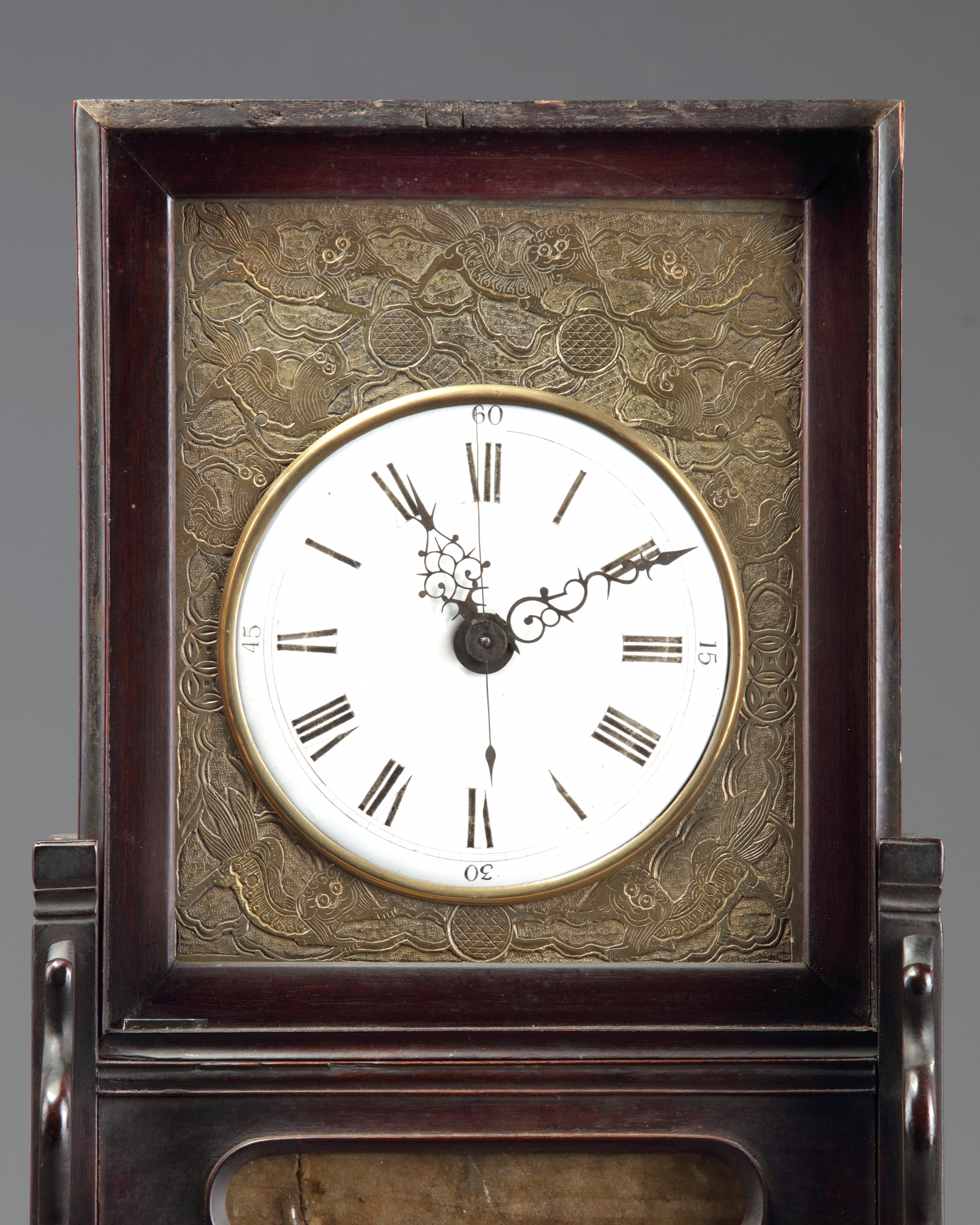 A Chinese gilt bronze table clock in a hongmu case and stand OAA