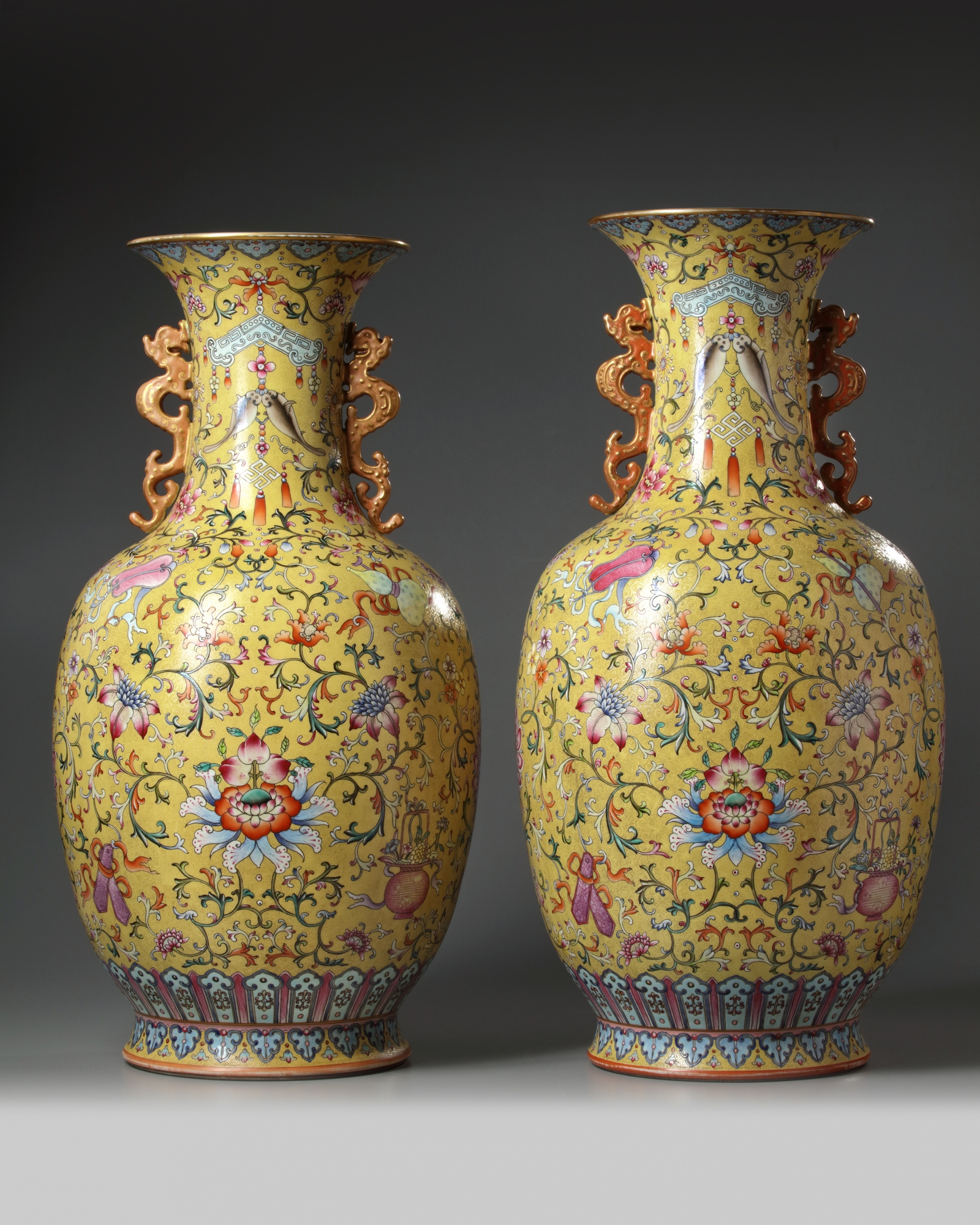 A PAIR OF LARGE CHINESE YELLOWGROUND FAMILLE ROSE VASES OAA