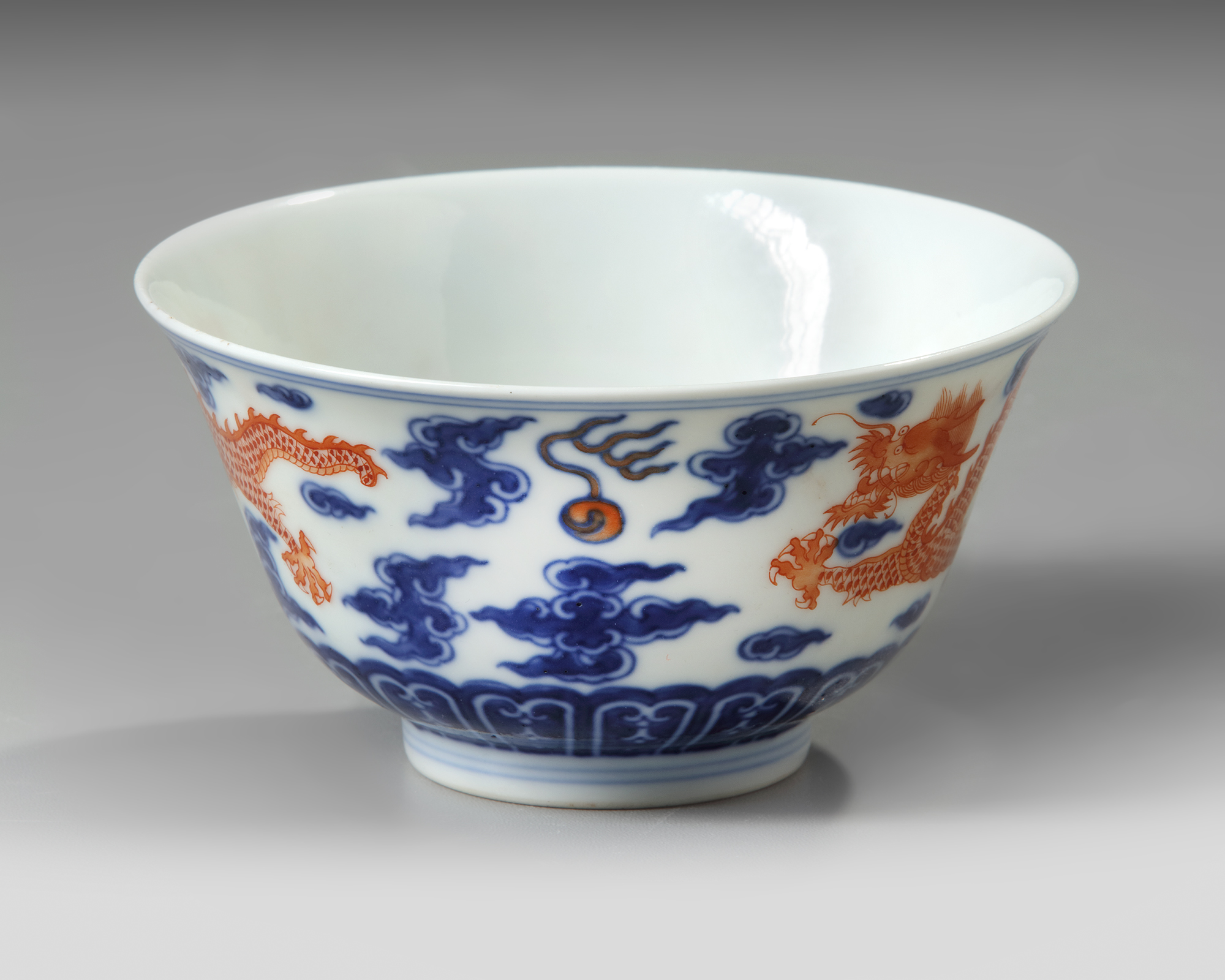 A CHINESE BLUE AND WHITE IRON RED DECORATED DRAGON BOWL SIX 