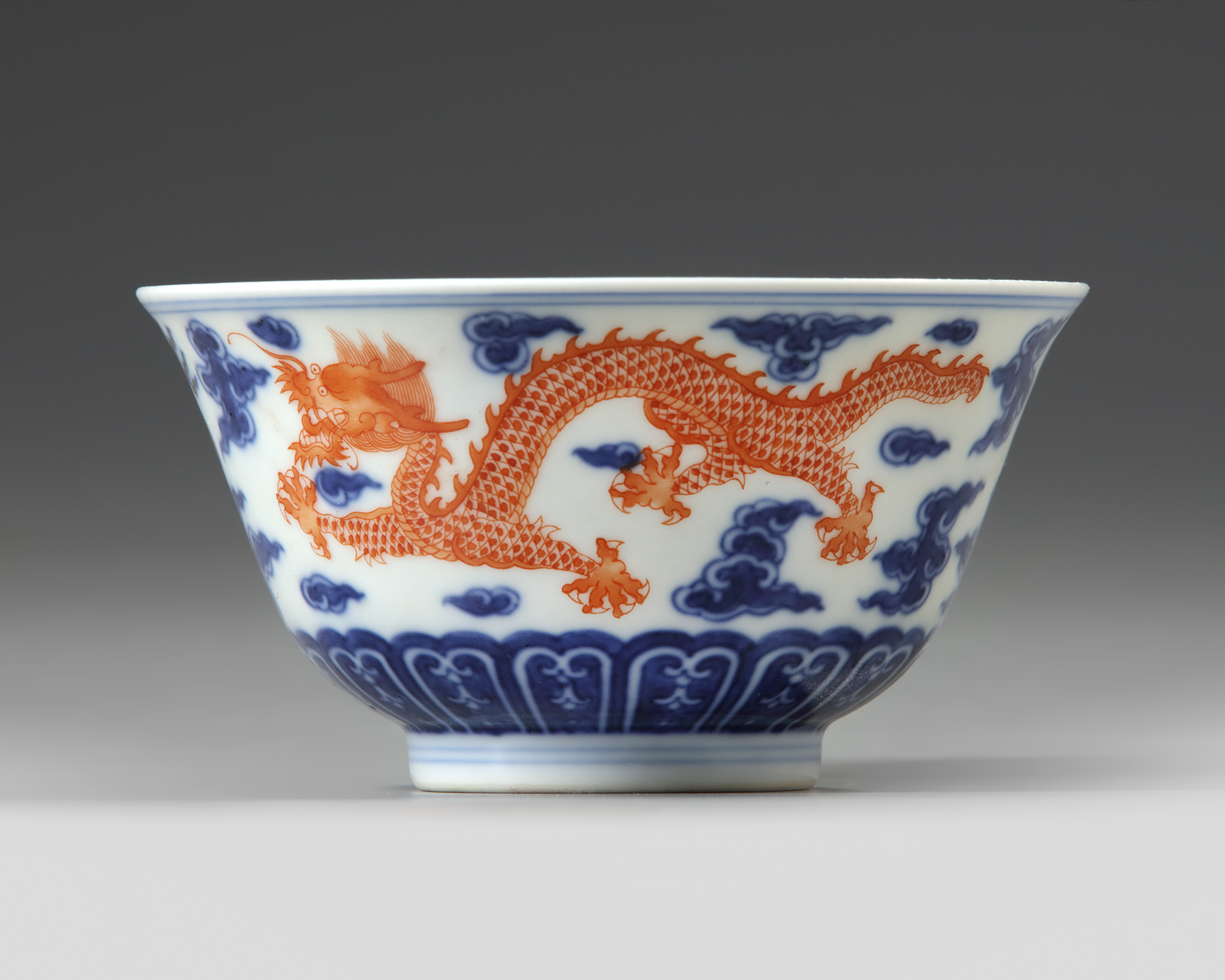 A CHINESE BLUE AND WHITE IRON RED DECORATED DRAGON BOWL SIX 