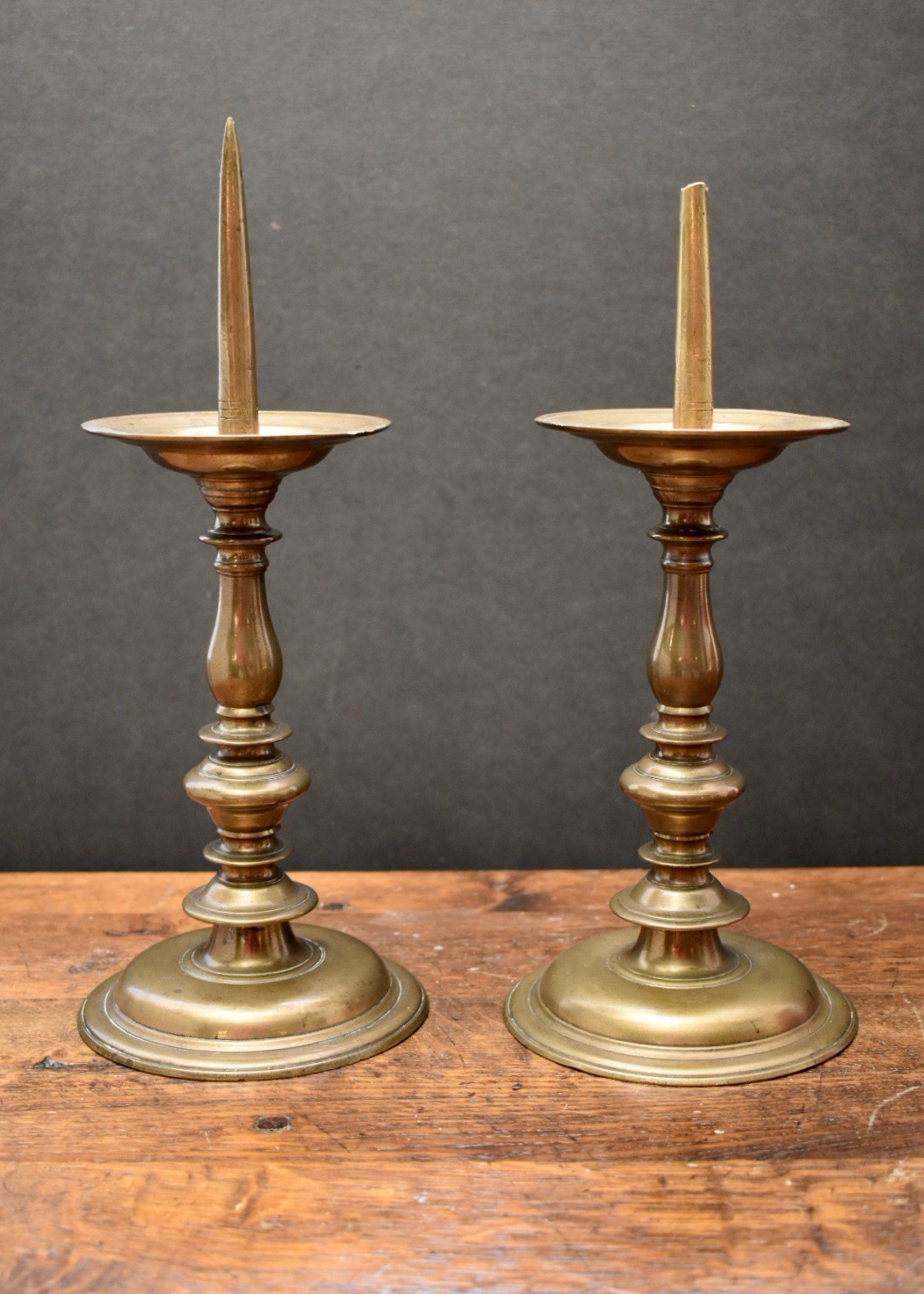 Lot 315 - A pair of Flemish brass pricket candlesticks