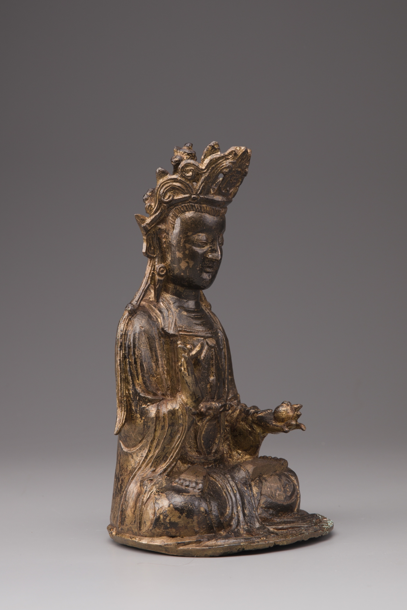 A Chinese gilt bronze seated figure of Guanyin OAA