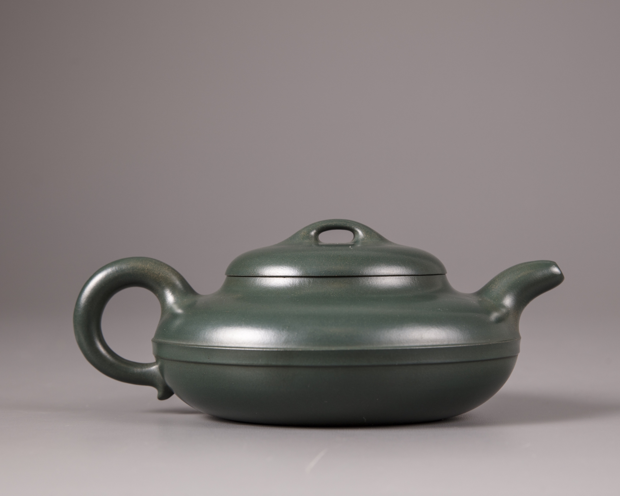 A Chinese greenclay yixing teapot and cover OAA