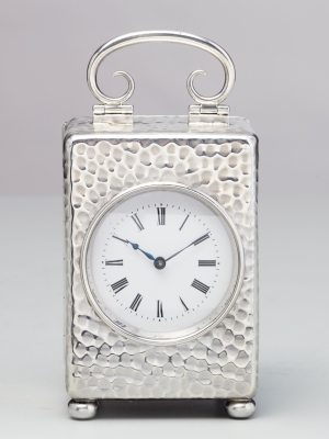 A small English silver travelling clock by William Comyns, circa 1900