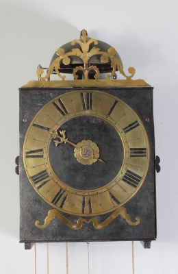 An early French provincial iron and brass Morbier wall clock, circa 1735