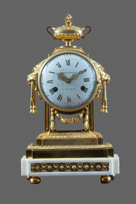 A fire-gilt bronze with white marble Louis Seize mantel clock Guenoux à Paris