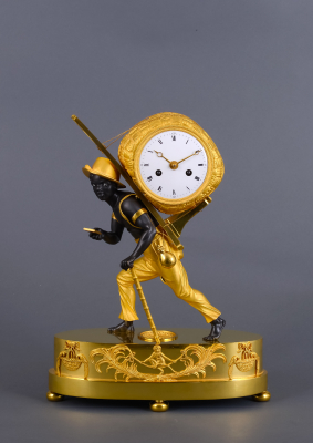 A beautiful French Empire 'au bon sauvage' mantel clock Portefaix