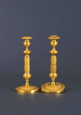 A pair of French Directoire candlesticks, around 1890