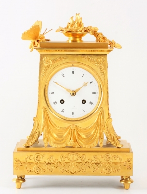 A lovely French Empire ormolu borne mantel clock with butterfly, circa 1800