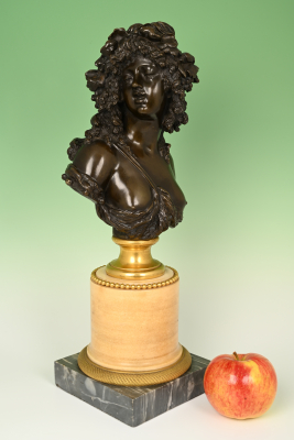 A bronze buste, represents a Bacchante