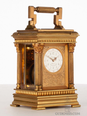 A small French glit brass travel clock by Lepine, circa 1900.