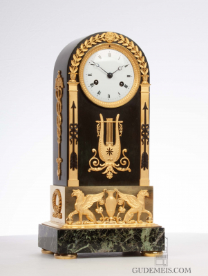 A French Empire ormolu and bronze arched mantel clock, circa 1800