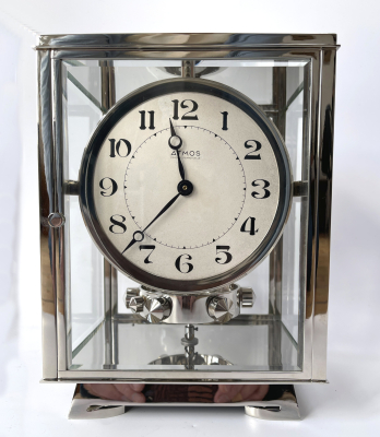A nickel Atmos clock, J. L. Reutter, silvered dial, no. 8858, France ca. 1930.