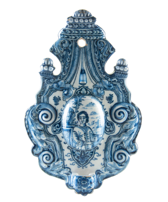 A Blue and White Dutch Delft Earthenware Sconce Decorated with a Figure
