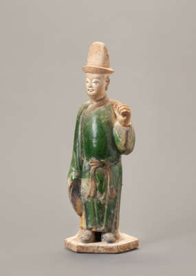 A Chinese green-glazed pottery figure of a tomb attendant