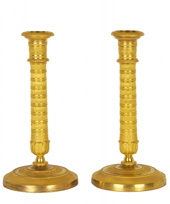 A Pair of Empire Candlesticks in Guilded Bronze