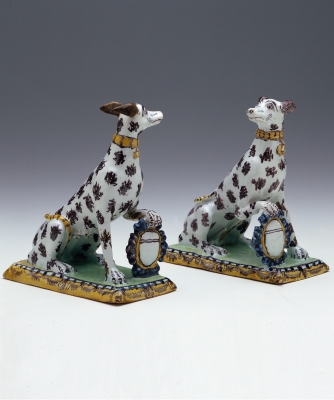 A Pair Polychrome Decorated Sitting Dogs in Brussels Earthenware