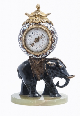 Cute miniature time piece pendulum of a bronze elephant carrying the movement 